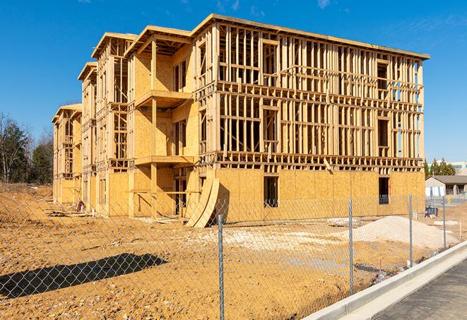 a snapshot of temporary chain link fences protecting a large construction project from unauthorized access in Parma, MI